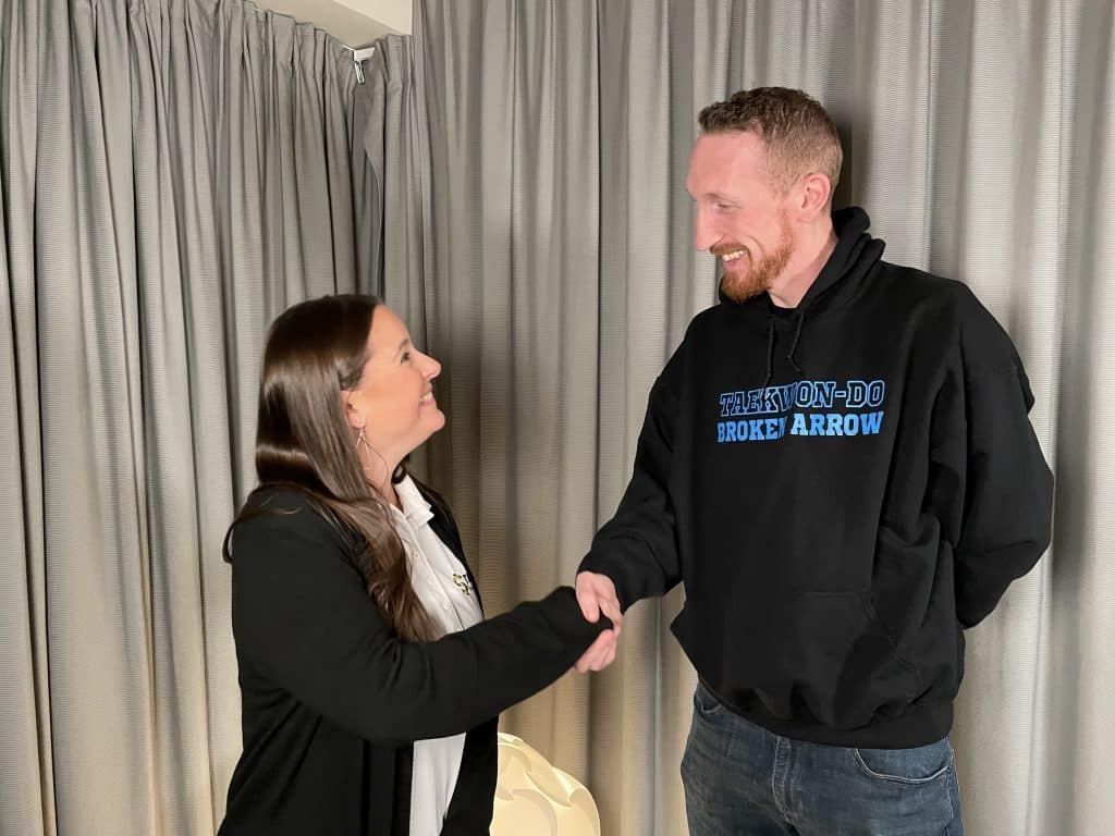 IMG_4336 TEDC Loan Closings and Compliance Manager Joanna Oxford shakes hands with Kristoffer Morrison as they close on his SBA Microloan