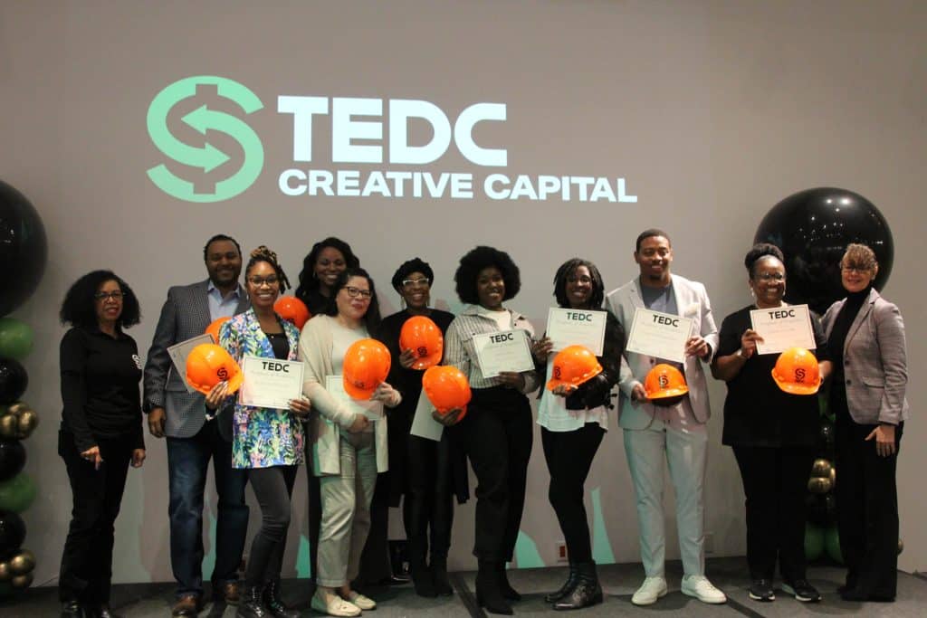 IMG_5383 reBUILD cohort 3 hold up their certificates and pose with TEDC CEO and EDEN director.