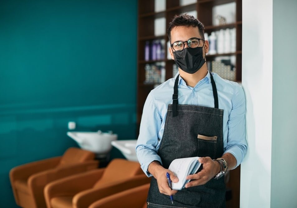 Happy,Hairdresser,Wearing,Face,Mask,While,Working,At,Hair,Salon hair salon during coronavirus pandemic